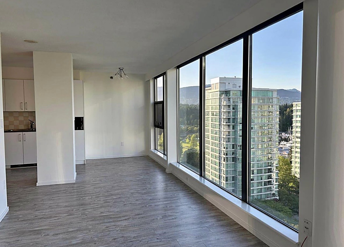 Freshly painted bright condo living room with a city view